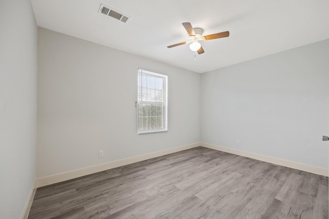 635 N San Pablo Ave, Fresno, CA 93728 - spare room with baseboards, a ceiling fan, wood finished floors, and visible vents