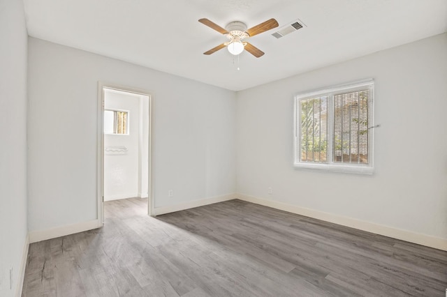 635 N San Pablo Ave, Fresno, CA 93728 - empty room with visible vents, baseboards, ceiling fan, and wood finished floors