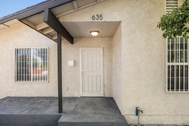 635 N San Pablo Ave, Fresno, CA 93728 - doorway to property featuring stucco siding