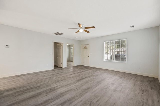 635 N San Pablo Ave, Fresno, CA 93728 - unfurnished room featuring visible vents, a ceiling fan, baseboards, and wood finished floors
