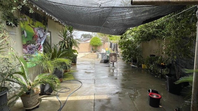 3535 E Grant Ave, Fresno, CA 93702 - fenced backyard with a patio