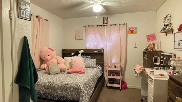 carpeted bedroom with a textured ceiling and ceiling fan