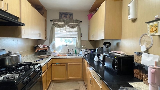 3535 E Grant Ave, Fresno, CA 93702 - kitchen featuring black appliances, range hood, and light tile patterned flooring