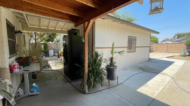 view of patio / terrace featuring fence
