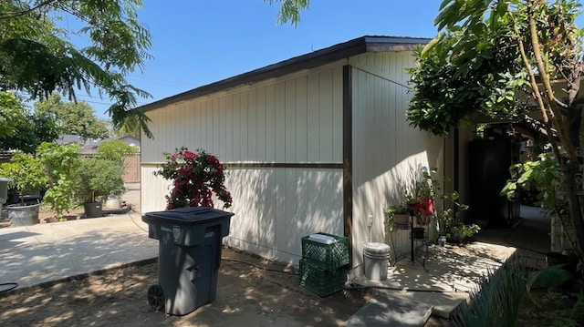 view of side of home with a patio area
