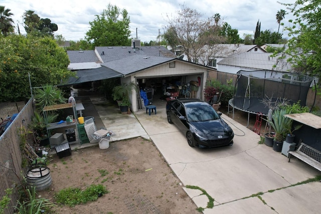 3535 E Grant Ave, Fresno, CA 93702 - view of parking featuring a trampoline and concrete driveway
