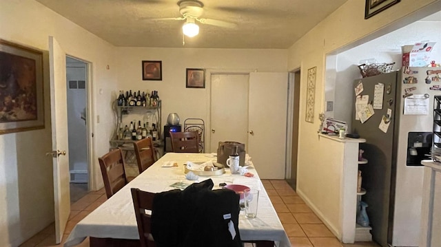 3535 E Grant Ave, Fresno, CA 93702 - dining space with light tile patterned floors and a ceiling fan