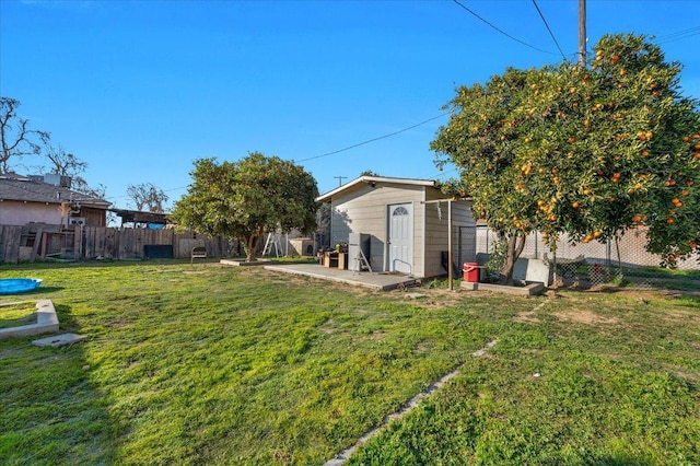 4185 E Turner Ave, Fresno, CA 93702 - view of yard featuring an outdoor structure and a fenced backyard