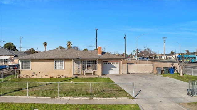 4185 E Turner Ave, Fresno, CA 93702 - ranch-style home with fence private yard, a garage, a front lawn, stucco siding, and driveway