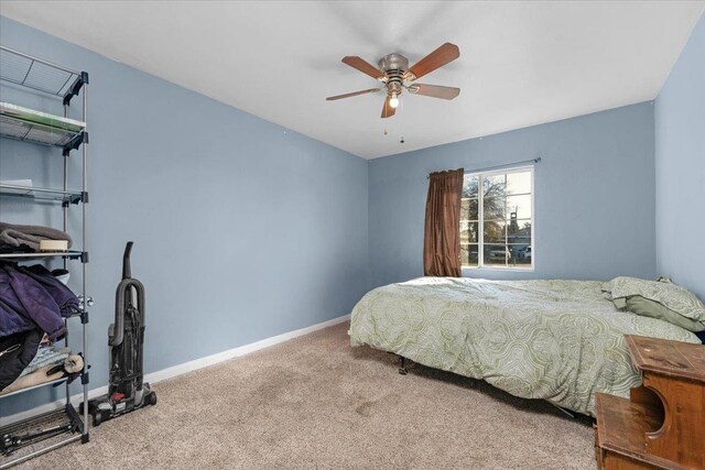 4185 E Turner Ave, Fresno, CA 93702 - carpeted bedroom featuring a ceiling fan and baseboards