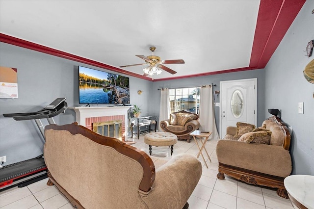 4185 E Turner Ave, Fresno, CA 93702 - living room with light tile patterned floors, a ceiling fan, and a brick fireplace