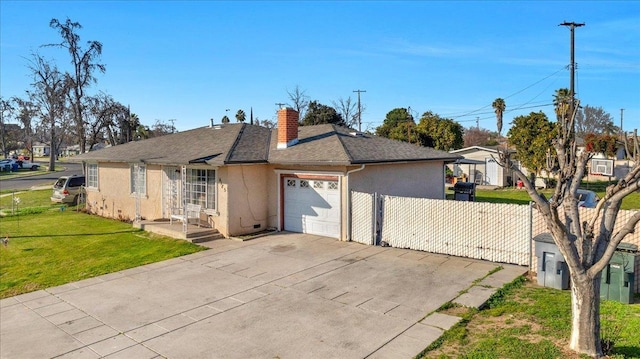 4185 E Turner Ave, Fresno, CA 93702 - view of front facade featuring an attached garage, fence, stucco siding, and a chimney
