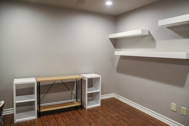 unfurnished office featuring baseboards, recessed lighting, and wood finished floors