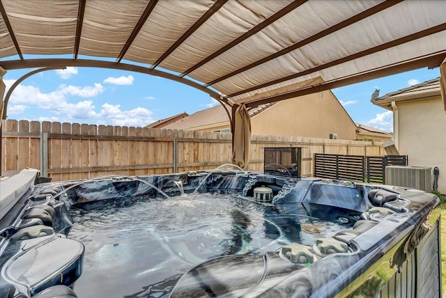 1938 W Van Gogh St, Hanford, CA 93230 - view of patio with a hot tub and a fenced backyard