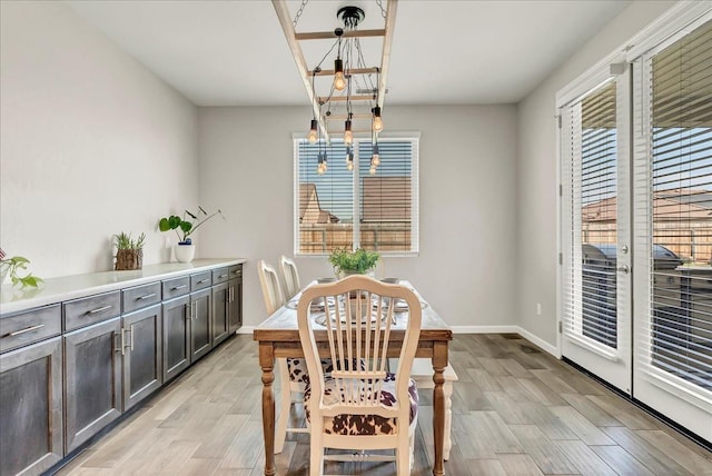 1938 W Van Gogh St, Hanford, CA 93230 - dining space with baseboards, light wood-style flooring, and a healthy amount of sunlight