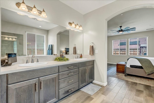 1938 W Van Gogh St, Hanford, CA 93230 - ensuite bathroom with a sink, baseboards, a ceiling fan, and double vanity