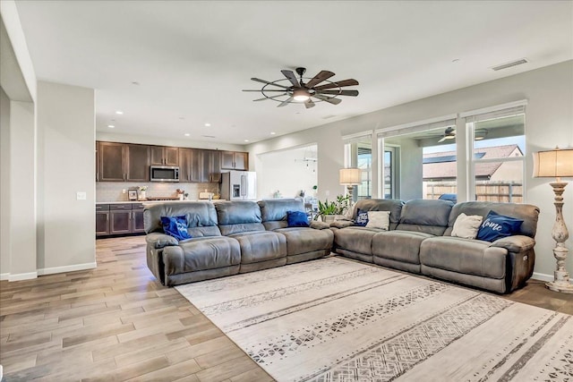 1938 W Van Gogh St, Hanford, CA 93230 - living area featuring ceiling fan, visible vents, baseboards, recessed lighting, and light wood-style flooring