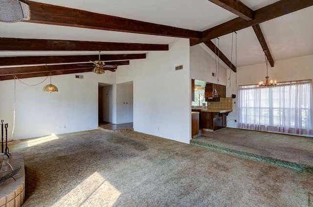 unfurnished living room featuring visible vents, lofted ceiling with beams, and carpet