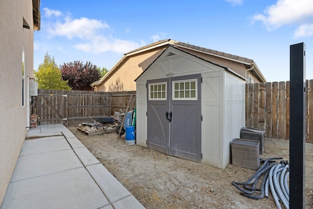 view of shed with a fenced backyard
