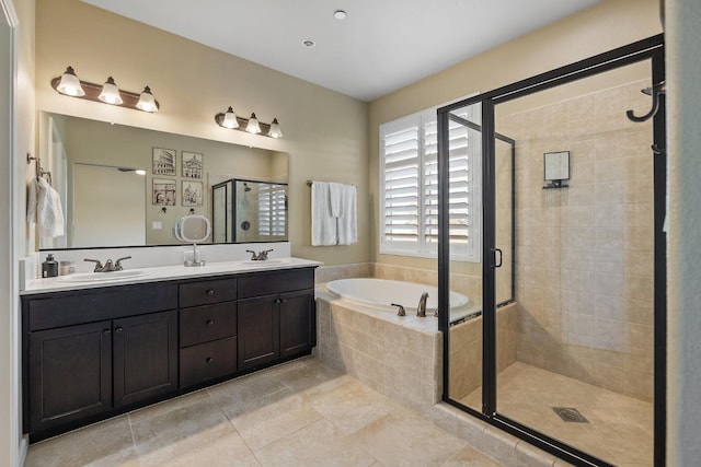 bathroom with a sink, tile patterned flooring, a stall shower, and a bath