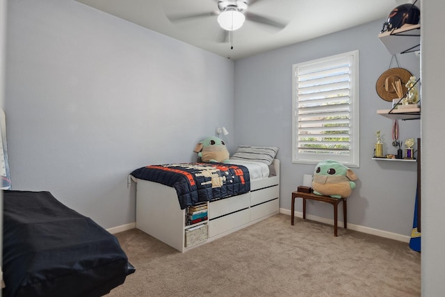 bedroom featuring a ceiling fan, baseboards, and carpet