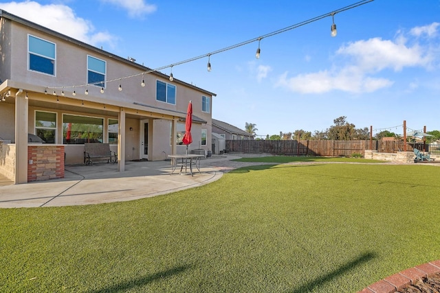 view of yard featuring a patio and a fenced backyard