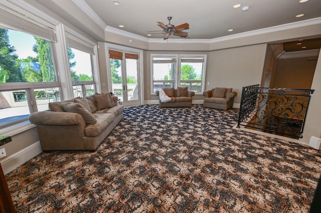 living area with crown molding, carpet floors, baseboards, ceiling fan, and french doors