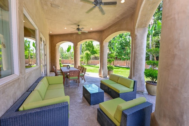 view of patio with an outdoor living space, a ceiling fan, fence, and outdoor dining space