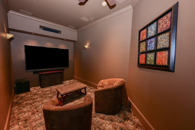 carpeted home theater room with a ceiling fan, baseboards, recessed lighting, visible vents, and ornamental molding