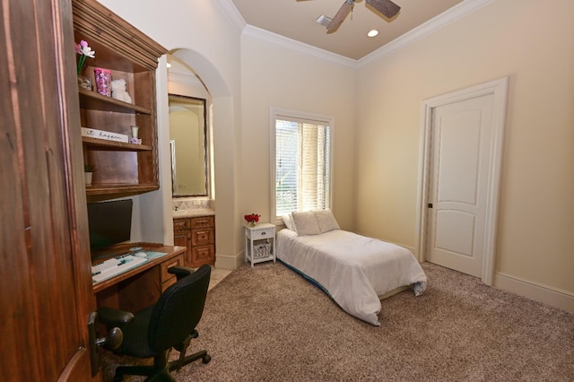 bedroom featuring baseboards, ornamental molding, a ceiling fan, and light colored carpet