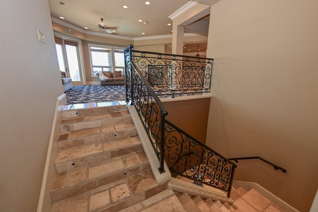 stairway featuring baseboards, ornamental molding, a ceiling fan, and recessed lighting