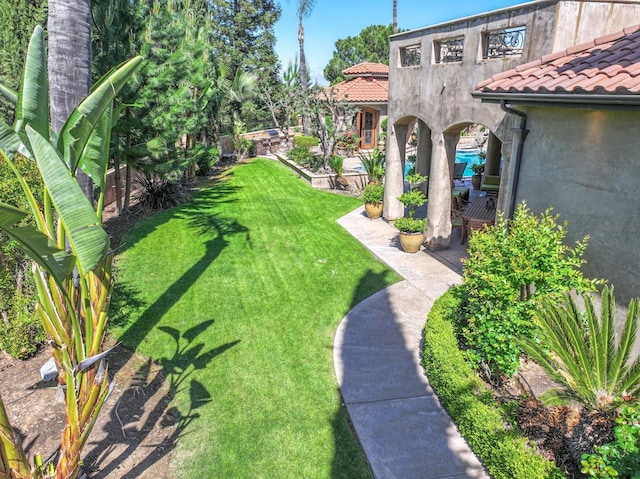 view of yard with a patio and fence
