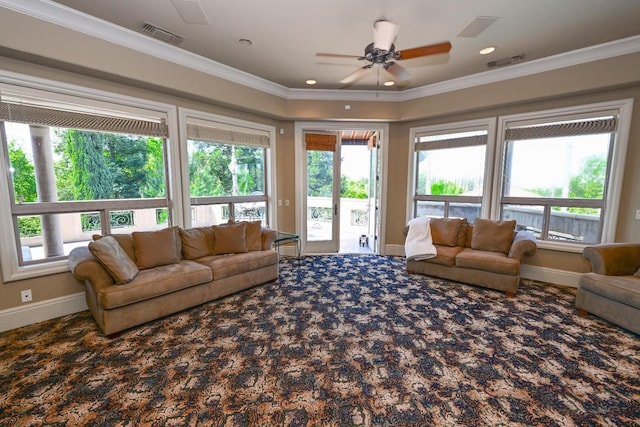 carpeted living area with a ceiling fan, visible vents, and plenty of natural light
