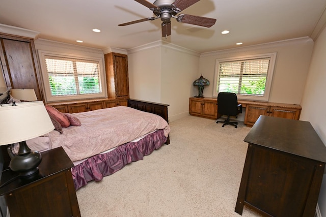 bedroom featuring light carpet, ornamental molding, and multiple windows