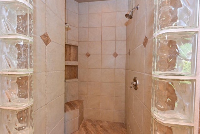 bathroom with tiled shower