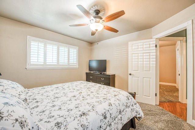 carpeted bedroom with ceiling fan