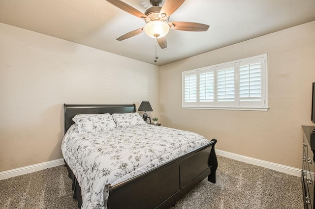 carpeted bedroom featuring baseboards and ceiling fan