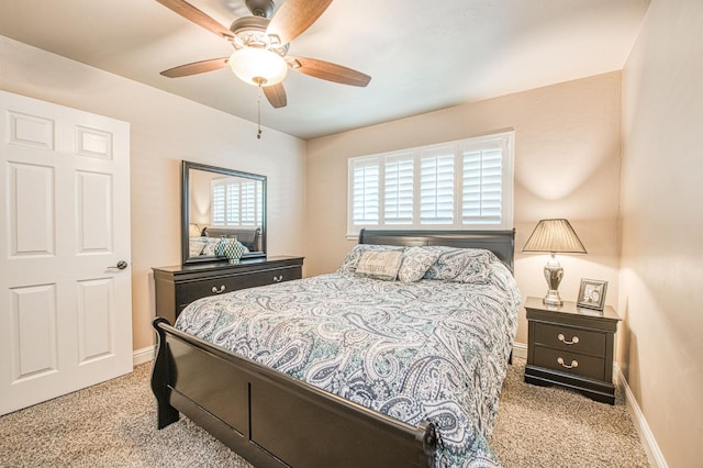 bedroom with baseboards, carpet, and a ceiling fan