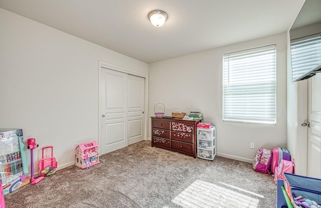 playroom with baseboards and carpet flooring