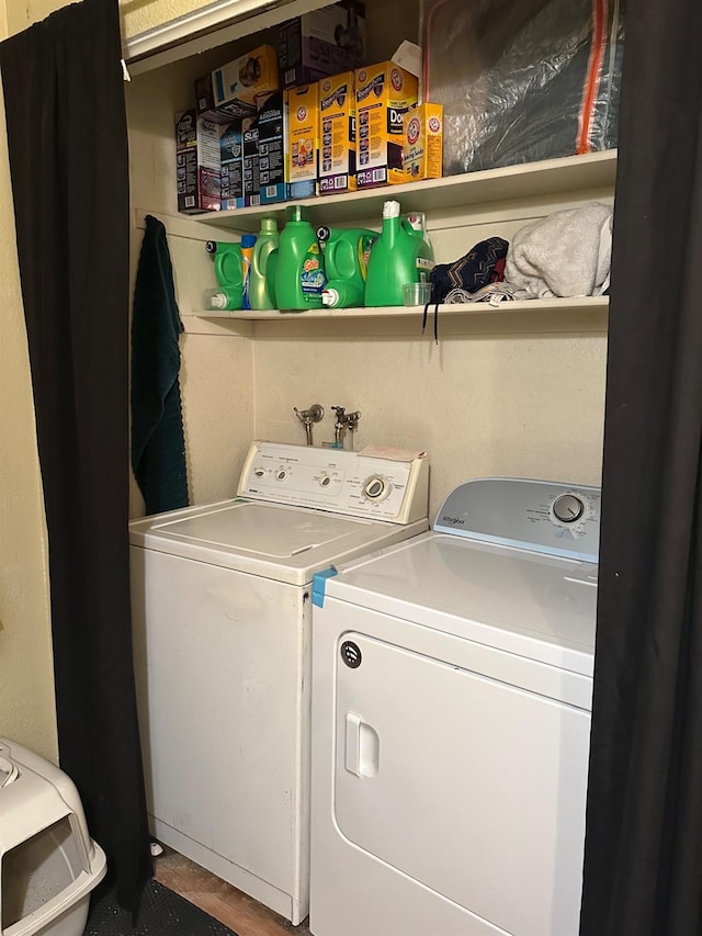 clothes washing area with laundry area and washer and dryer