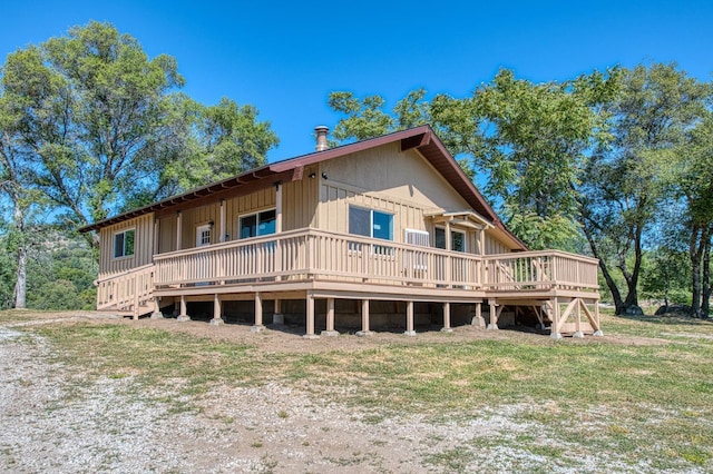 back of house with a wooden deck