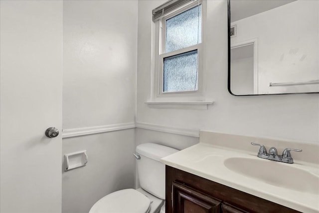 bathroom with vanity and toilet