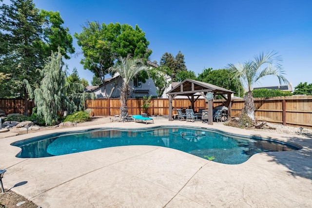 view of pool featuring a gazebo, a fenced backyard, a fenced in pool, and a patio