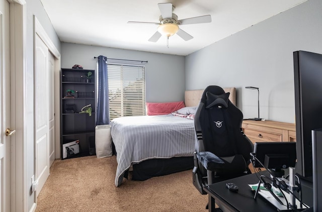 bedroom with a closet, carpet, and ceiling fan