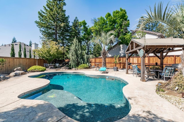 view of pool featuring a fenced backyard, a gazebo, and a patio area