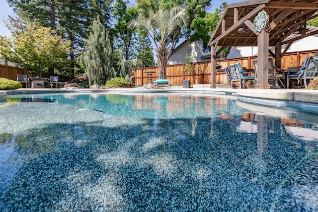 view of swimming pool featuring a fenced in pool and a fenced backyard