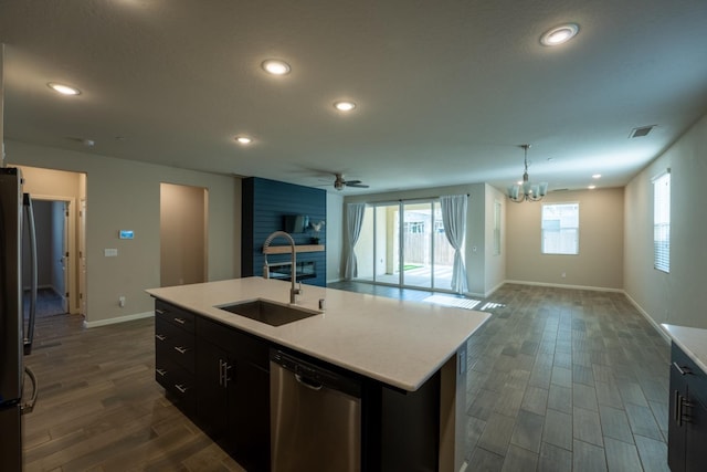 kitchen featuring visible vents, open floor plan, recessed lighting, a sink, and appliances with stainless steel finishes