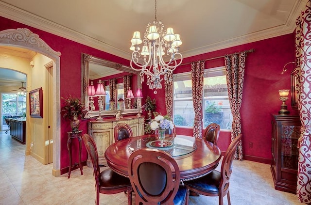 71 Omaha Ave, Clovis, CA 93619 - dining area featuring ornamental molding, a chandelier, baseboards, and arched walkways
