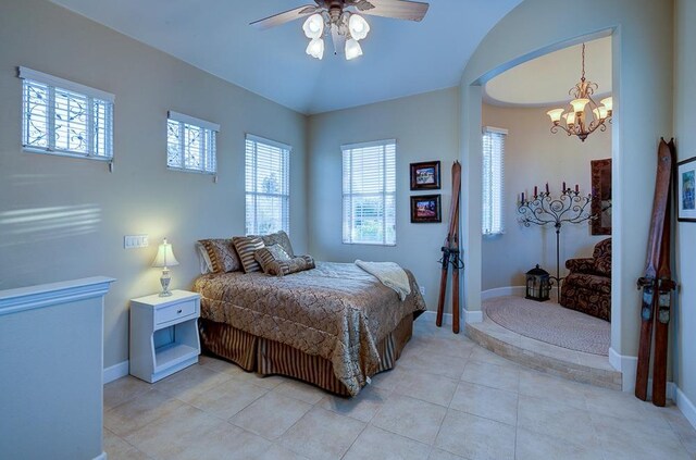 71 Omaha Ave, Clovis, CA 93619 - bedroom with a chandelier, baseboards, light tile patterned flooring, and a ceiling fan