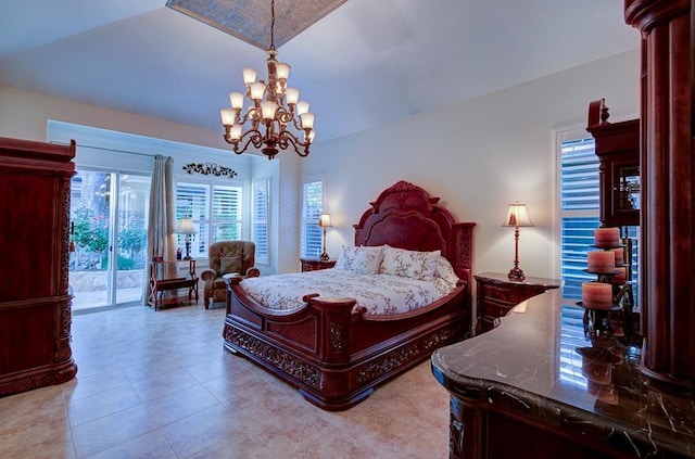 71 Omaha Ave, Clovis, CA 93619 - bedroom with access to exterior, a chandelier, and tile patterned flooring